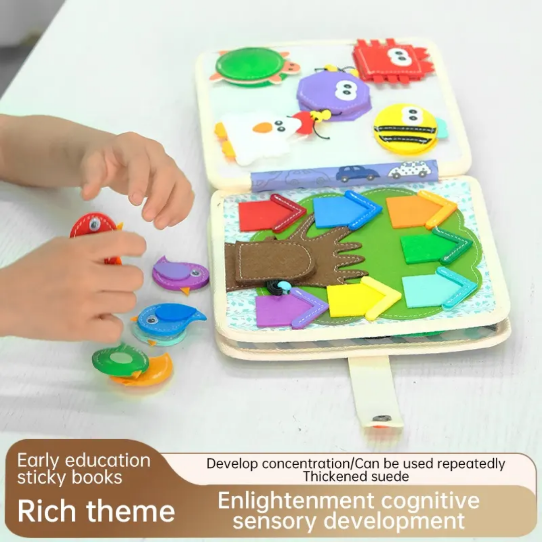Toddler playing with Montessori animal-themed quiet book, engaging in hands-on learning.