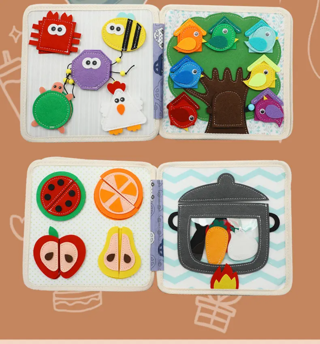 Open Montessori quiet book displaying multiple felt animal activity pages for toddlers.