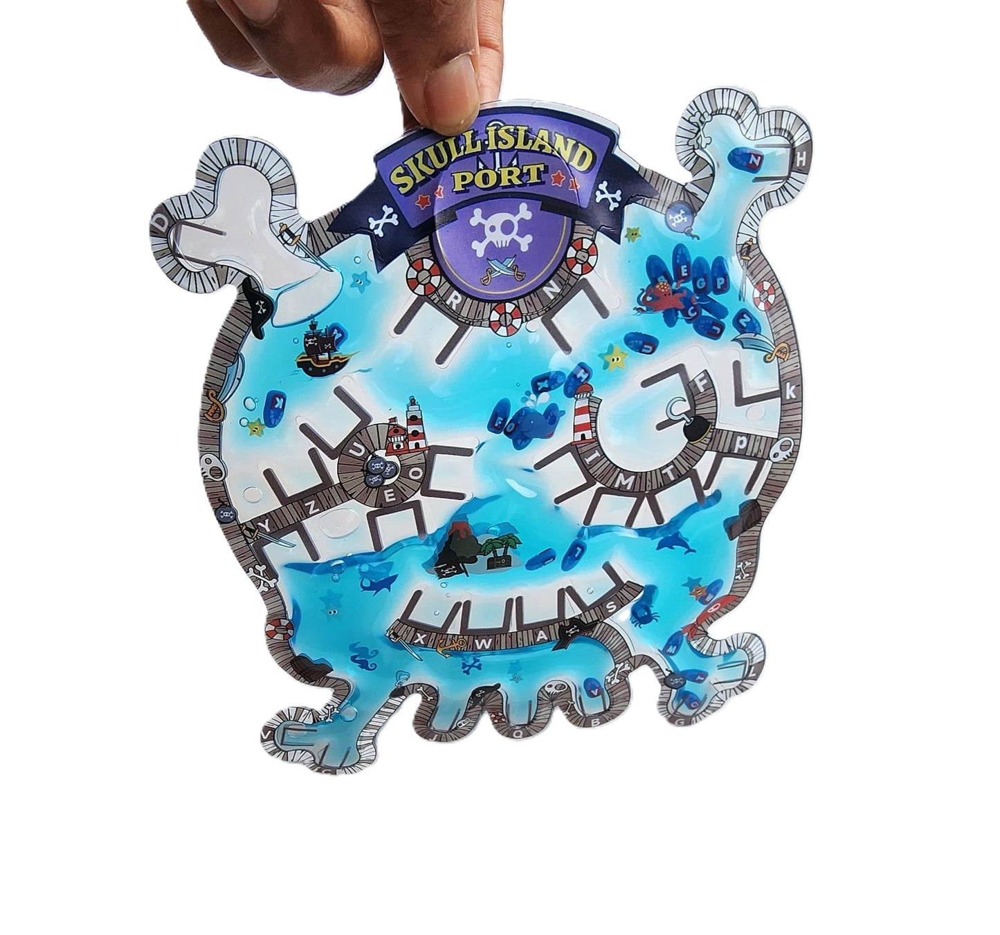 Child playing with Skull Island-shaped sensory gel pad to find hidden alphabets
