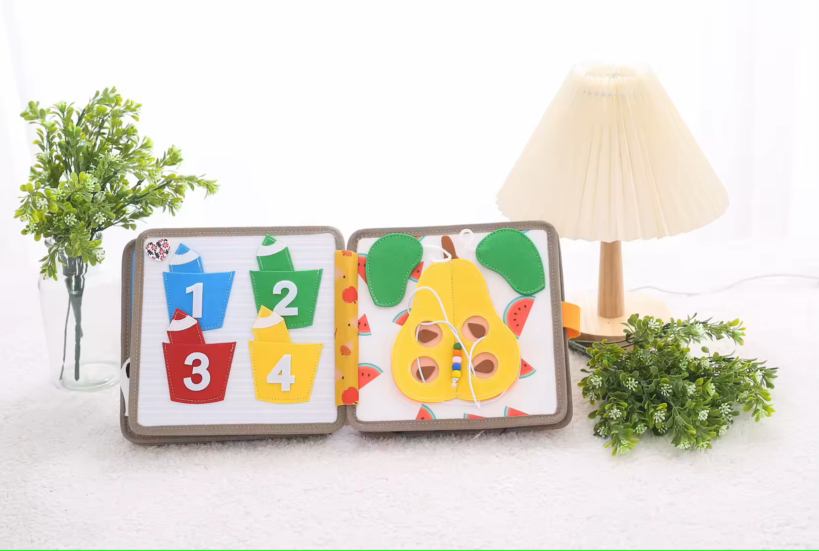 Soft sensory cloth book designed for toddlers aged 1 to 4 with textured pages
