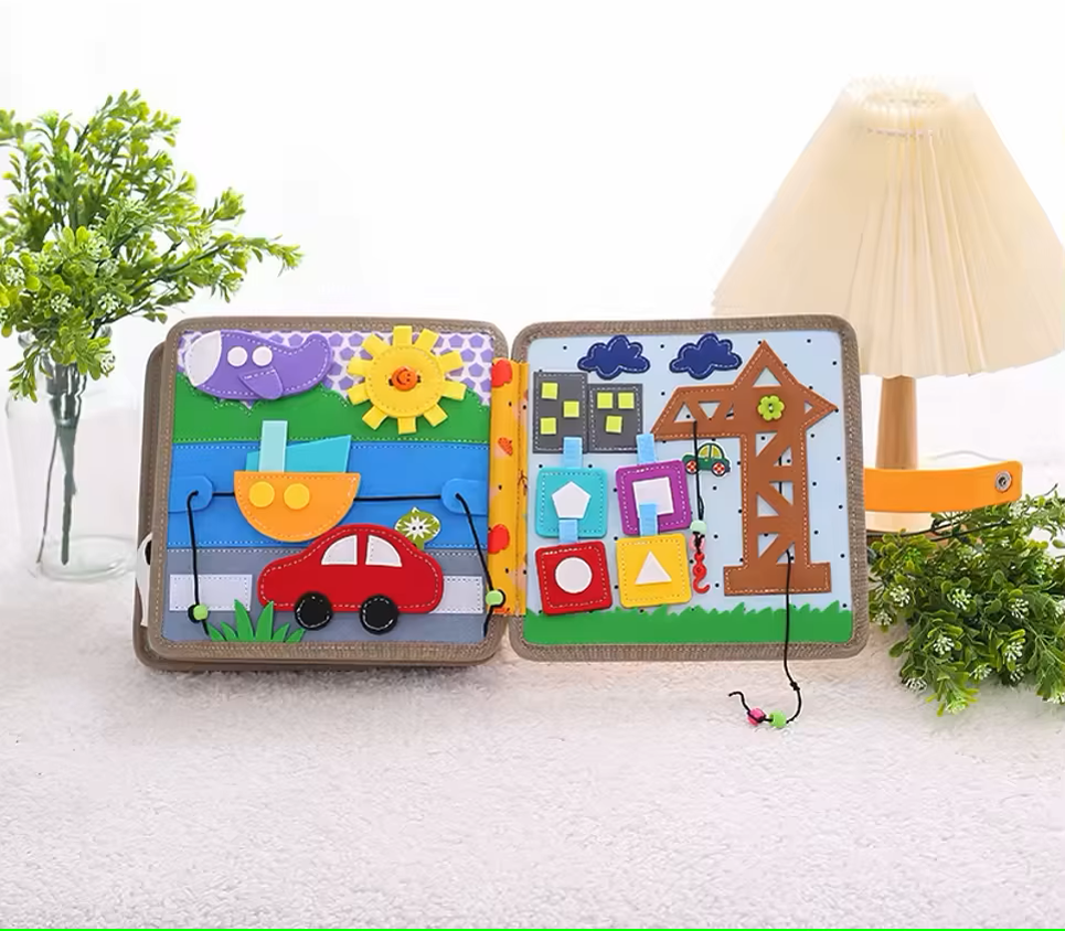Open quiet book showing various woodland-themed learning tasks and animal figures
