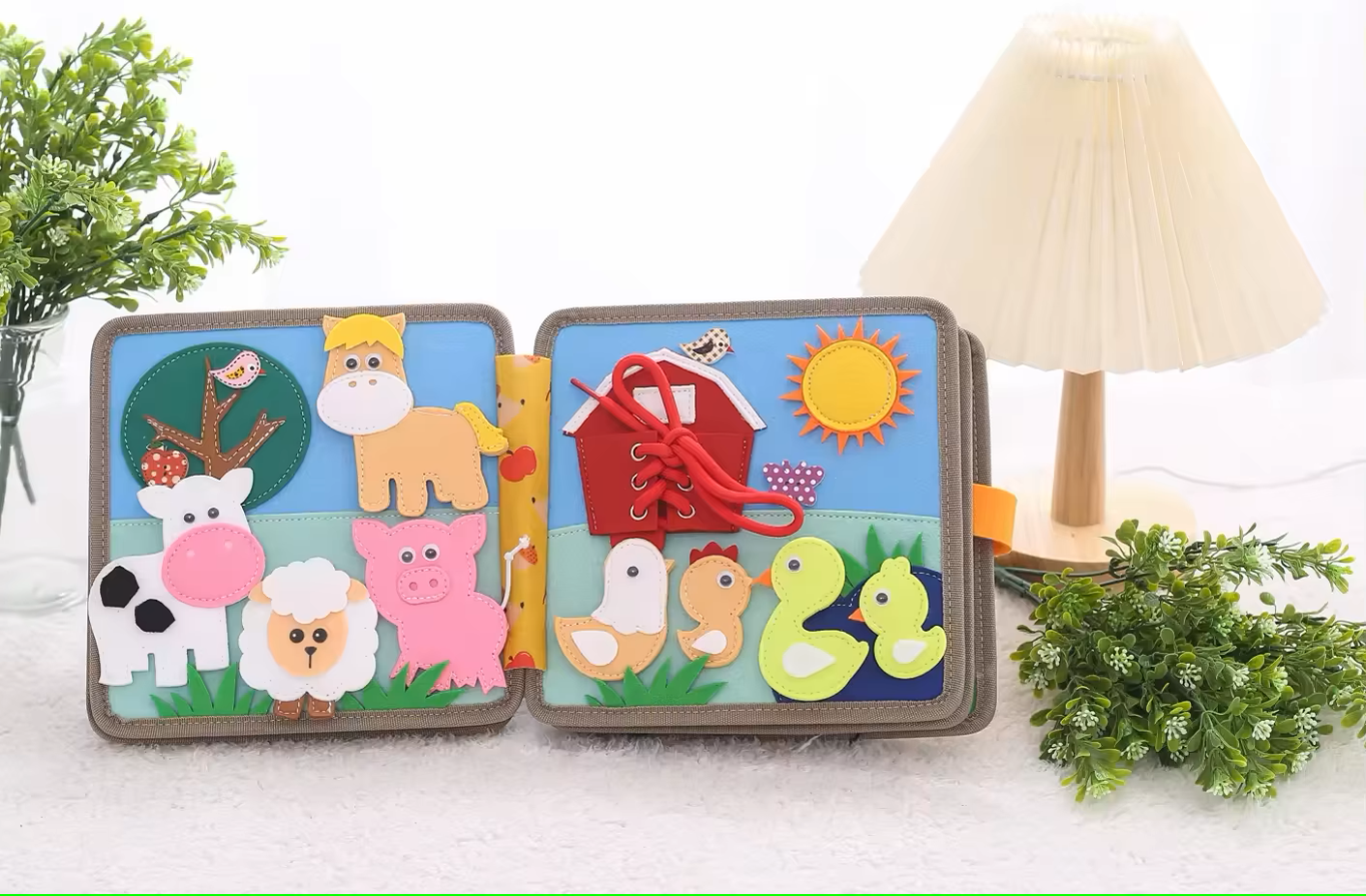 Fine motor skill activity with zippers and buttons inside the deer-themed quiet book
