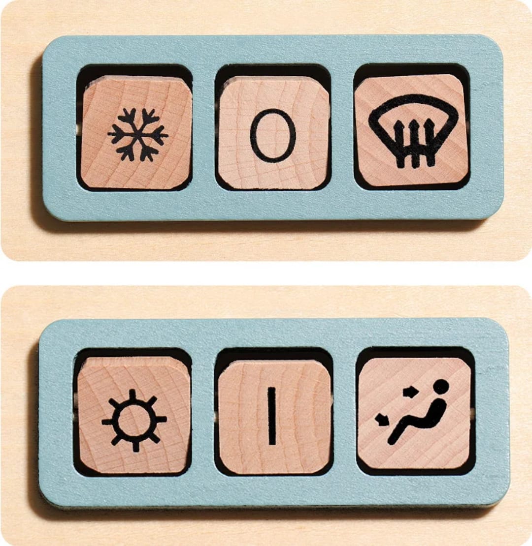Gear stick and dashboard controls on the wooden driving toy